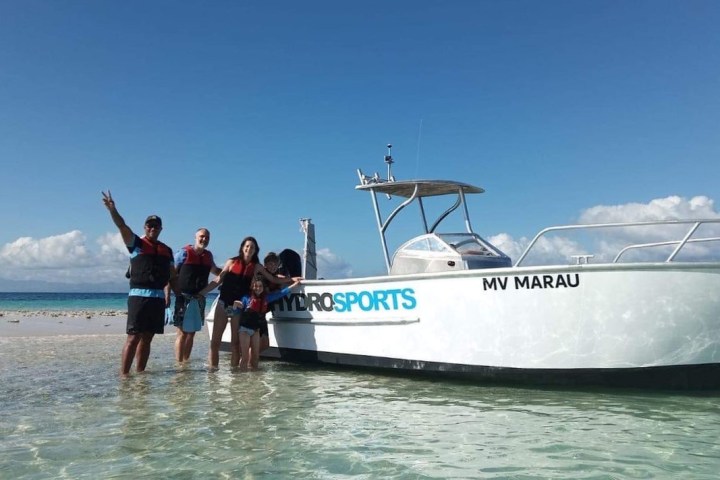 a group of people on a boat in the water