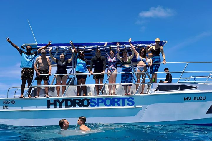 a group of people on a boat in the water