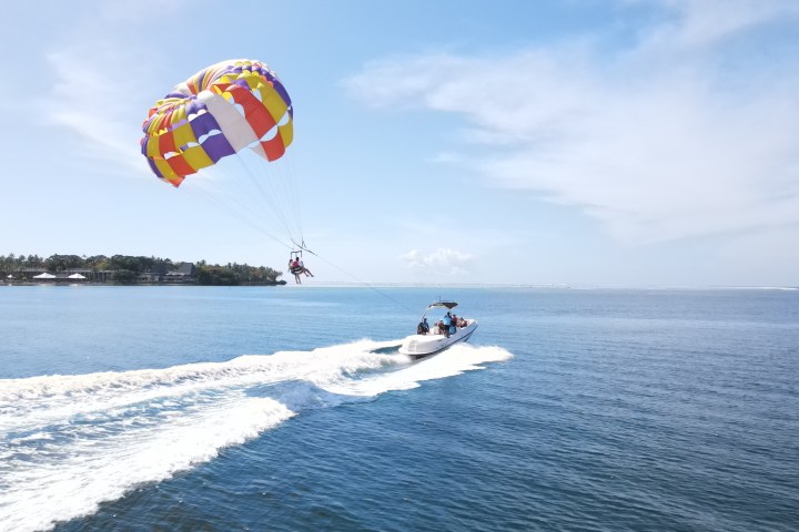 people parasailing over a body of water